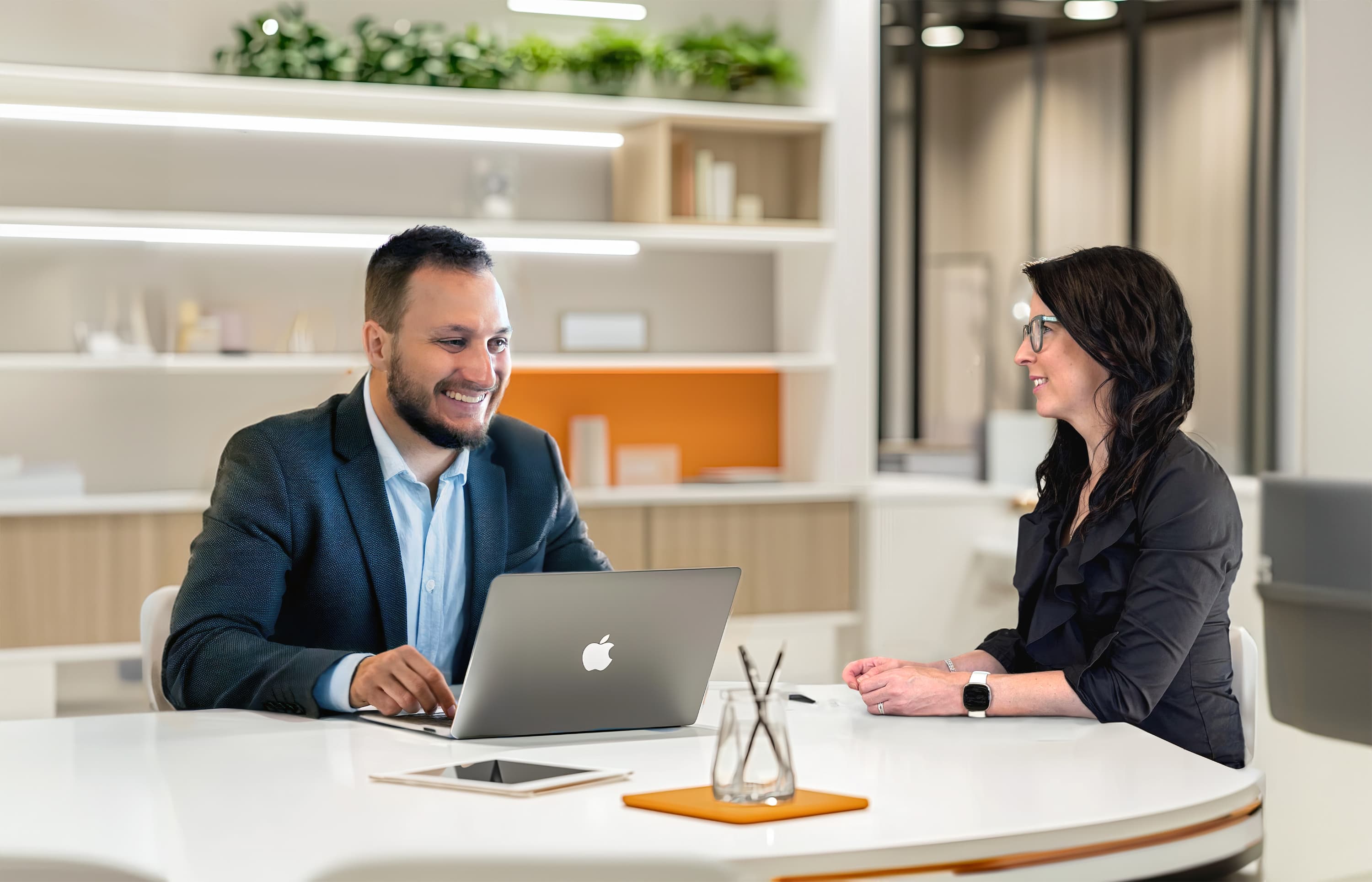 Dani and Will of Mighty Spark Communications in a professional meeting